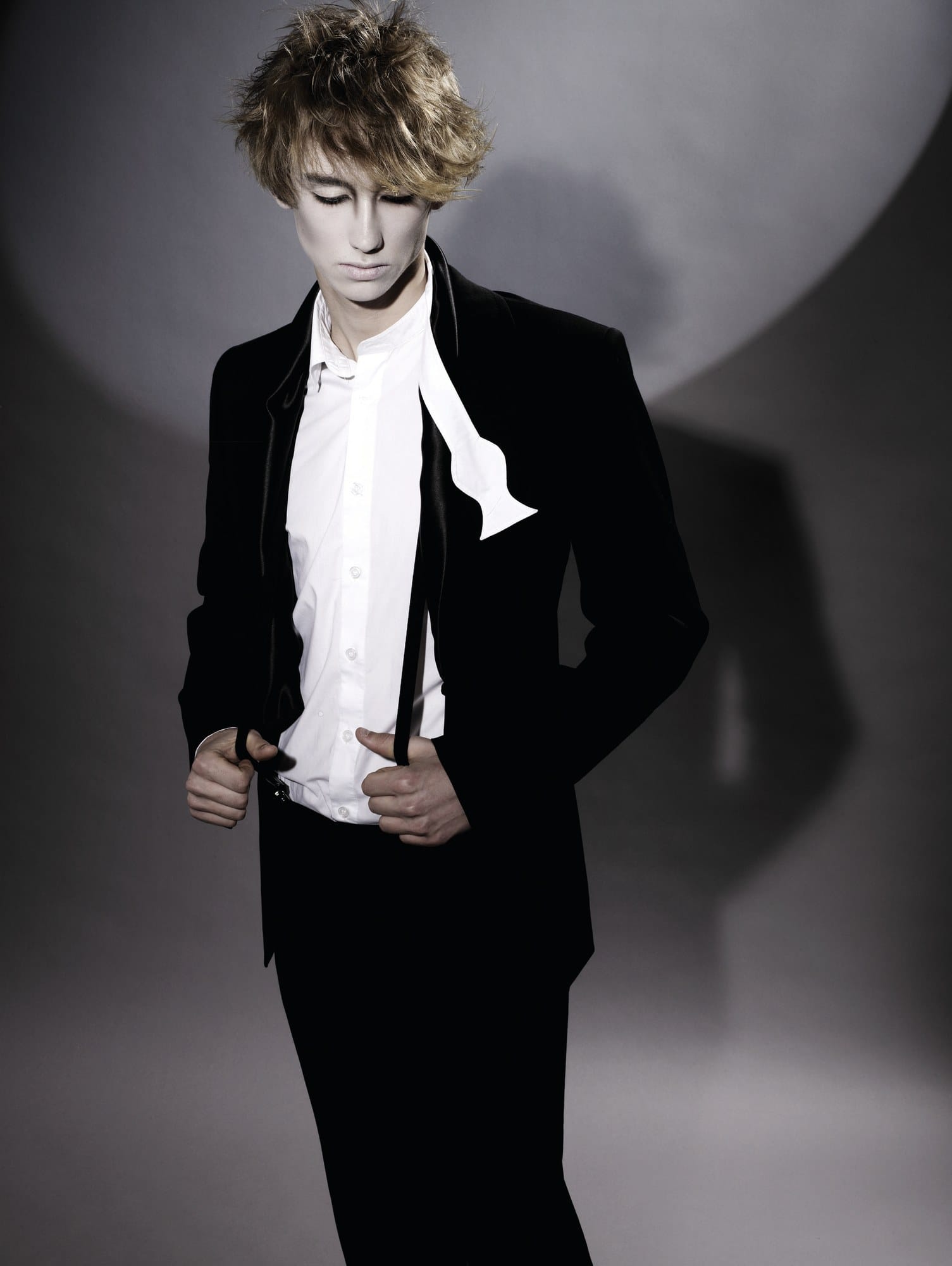 Tousled blond men's crop with spiky texture, open white shirt and black suit – Anime Men's Collection, Brooks & Brooks 2007