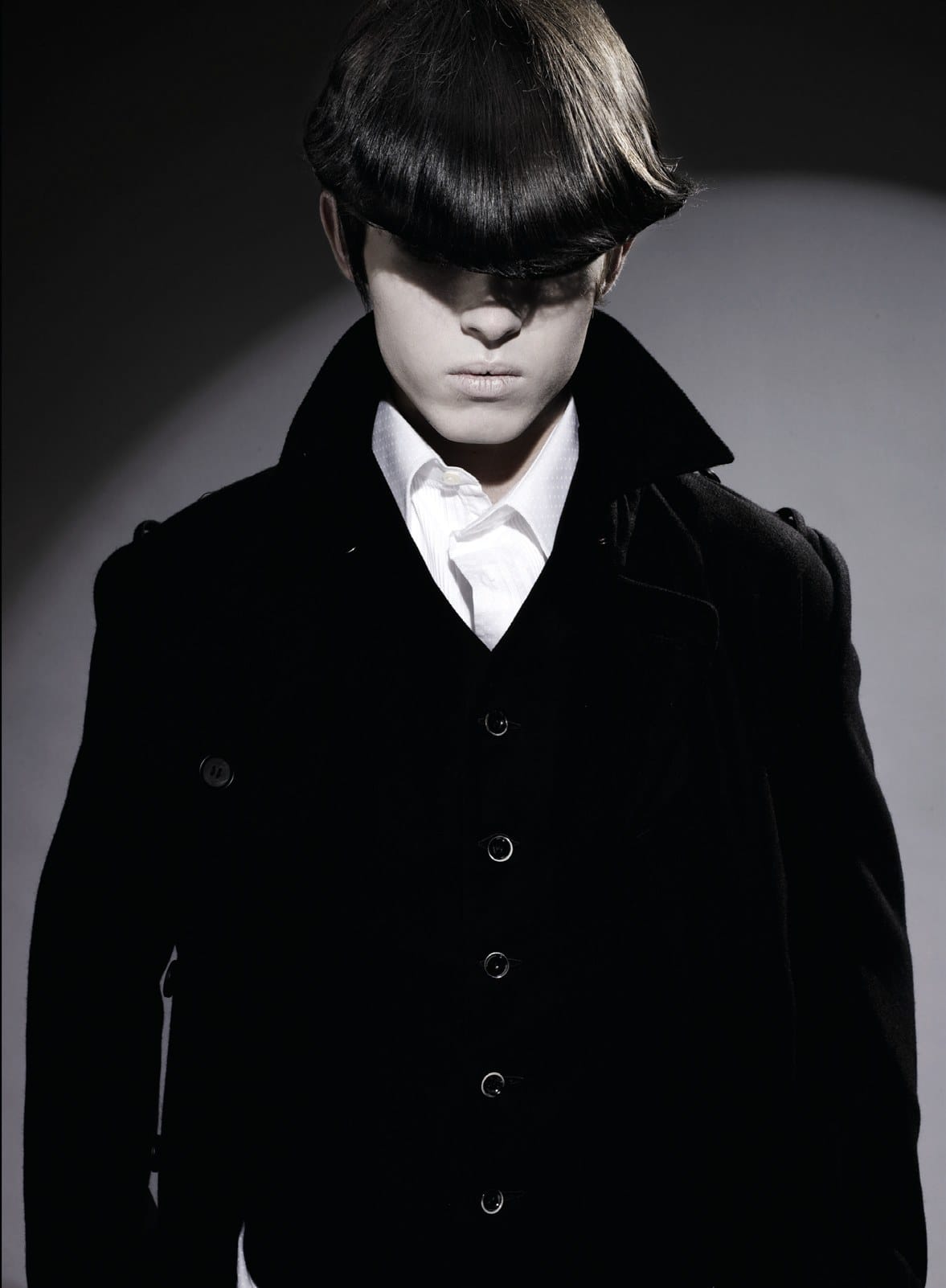 Heavy glossy bowl cut covering the eyes, black double-breasted coat – Anime Men's Collection, Brooks & Brooks 2007
