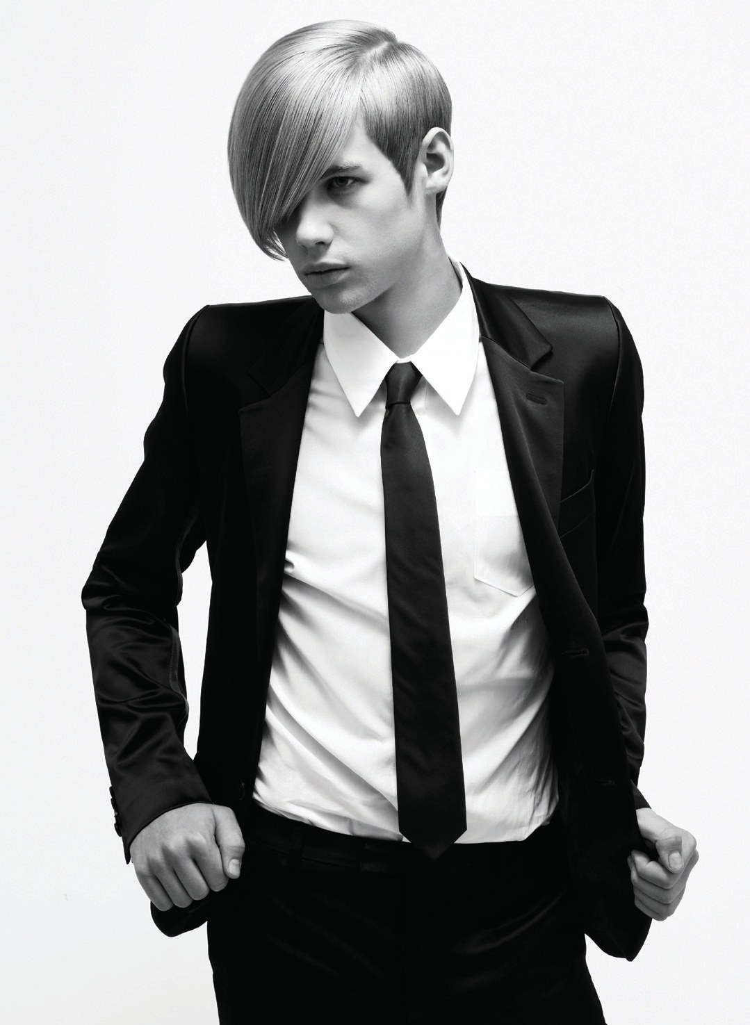 Men's long asymmetric fringe with a black suit – Essensuals Collection, Jim Shaw 2008