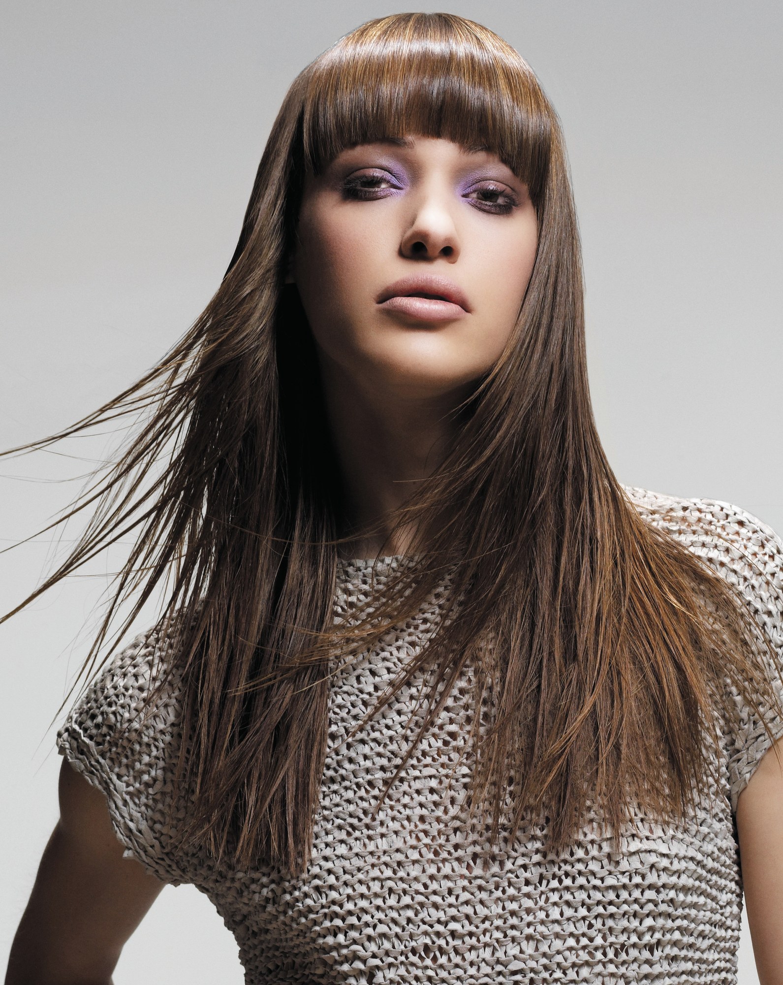 Long sleek brunette hair with a heavy fringe in motion – Essensuals Collection, Stephen Fordham 2008