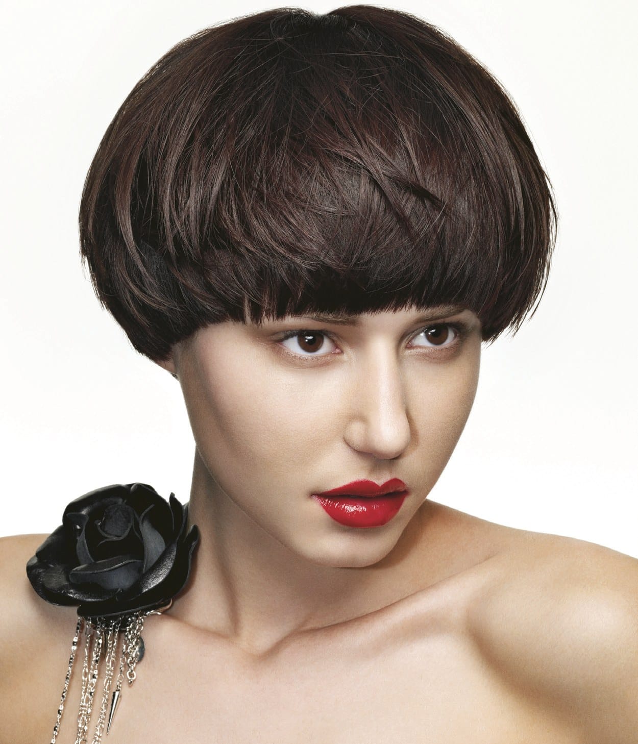 Short brunette bob with a blunt fringe, red lips and a black spiked rose brooch – Hob Collection 2006/7, Kris Benns 2007