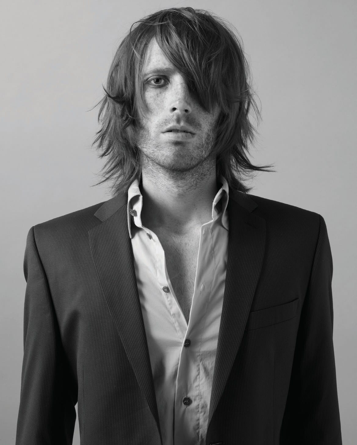 Long shaggy layers with a curtain fringe, pinstripe suit – Men's Collection, Dean Spearing TONI&GUY 2007