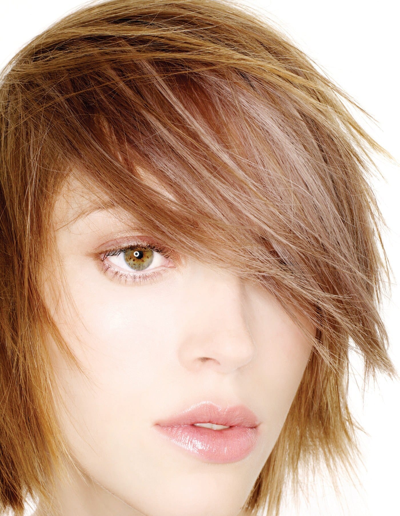 Razored copper-brown layers with a long fringe sweeping over one eye – Toni & Guy Collections, Jo O'Neill 2007