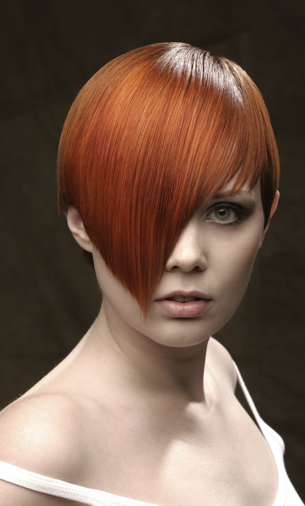 Glossy copper bob with a long asymmetric fringe over one eye – Toni & Guy Collections, Pascal Van Loenhout 2007