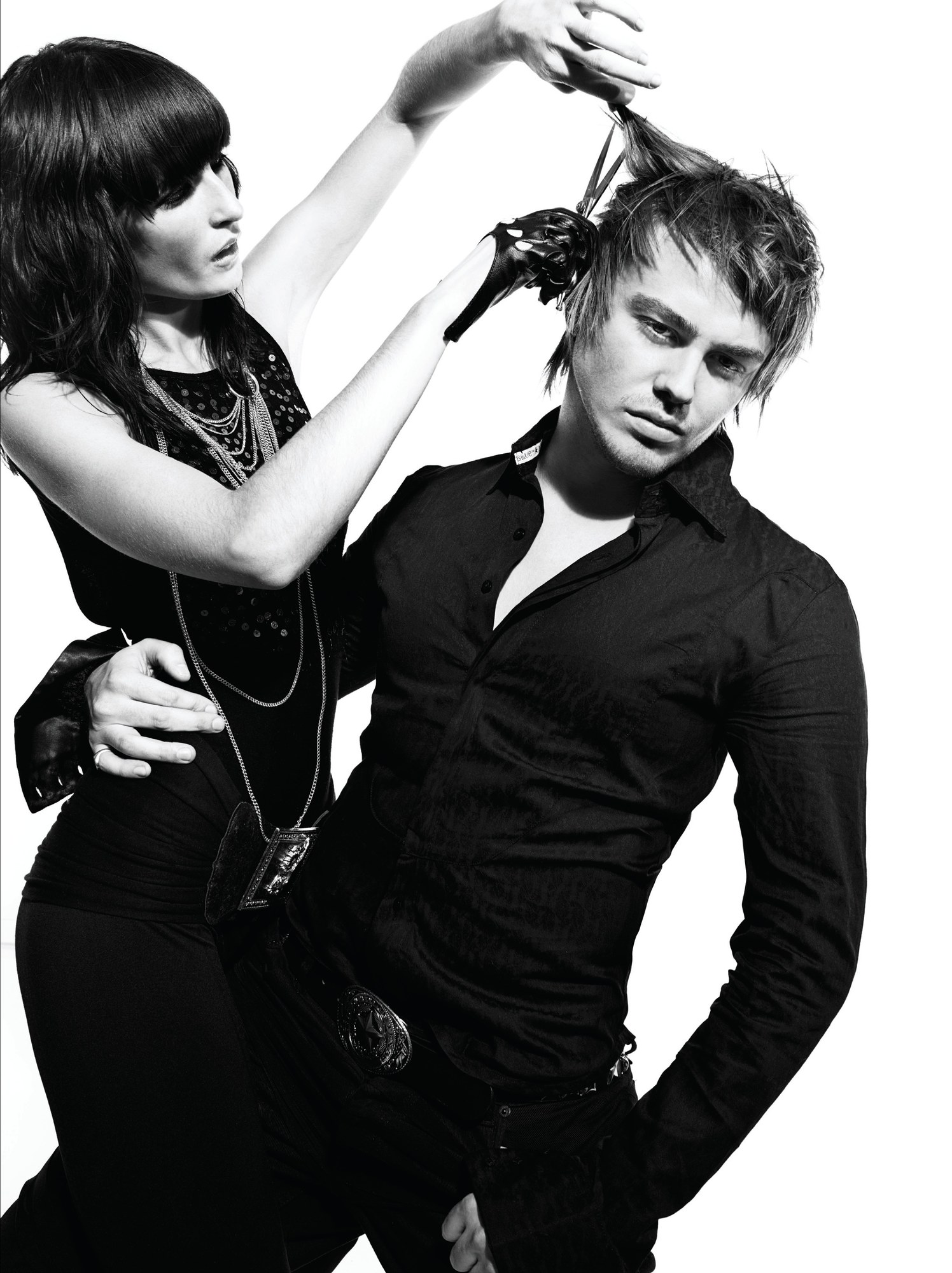 Woman with a heavy dark fringe styling a man's tousled hair, black and white – Bed Head Collection, TIGI International Creative Team 2008