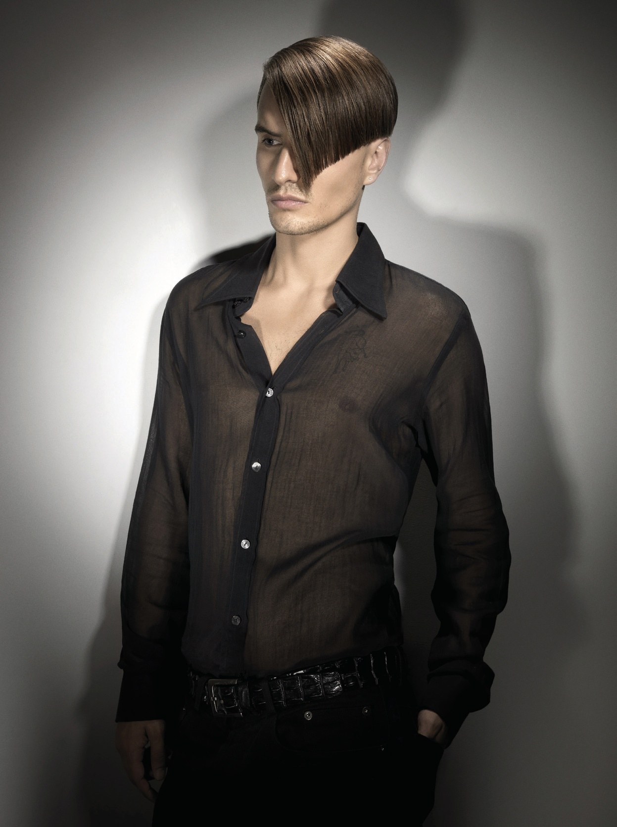 Men's long side-swept fringe covering one eye, sheer black shirt – British Hairdresser of the Year, Akin Konizi 2008