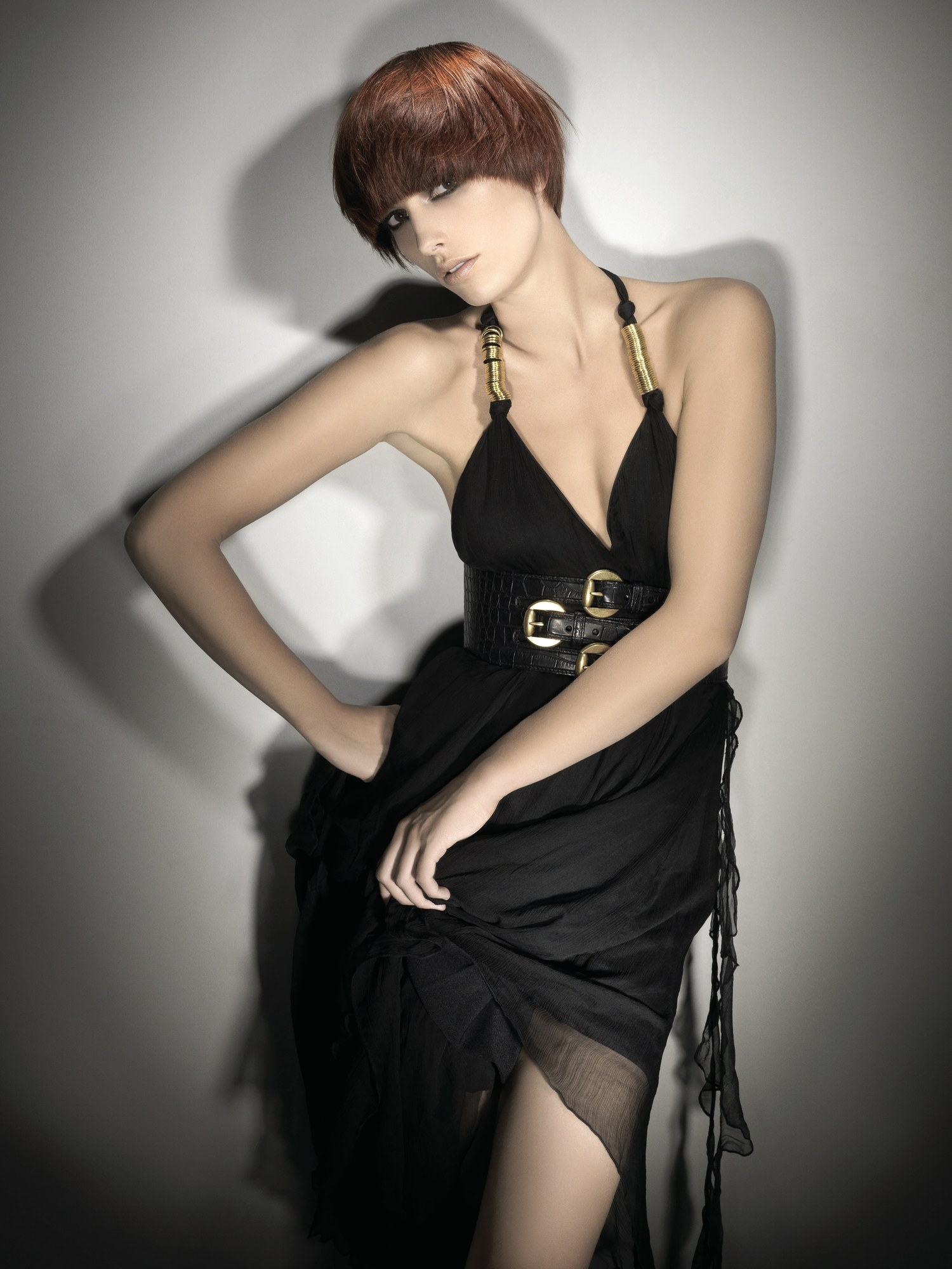 Auburn bob with a short rounded fringe, black halter dress – British Hairdresser of the Year, Akin Konizi 2008