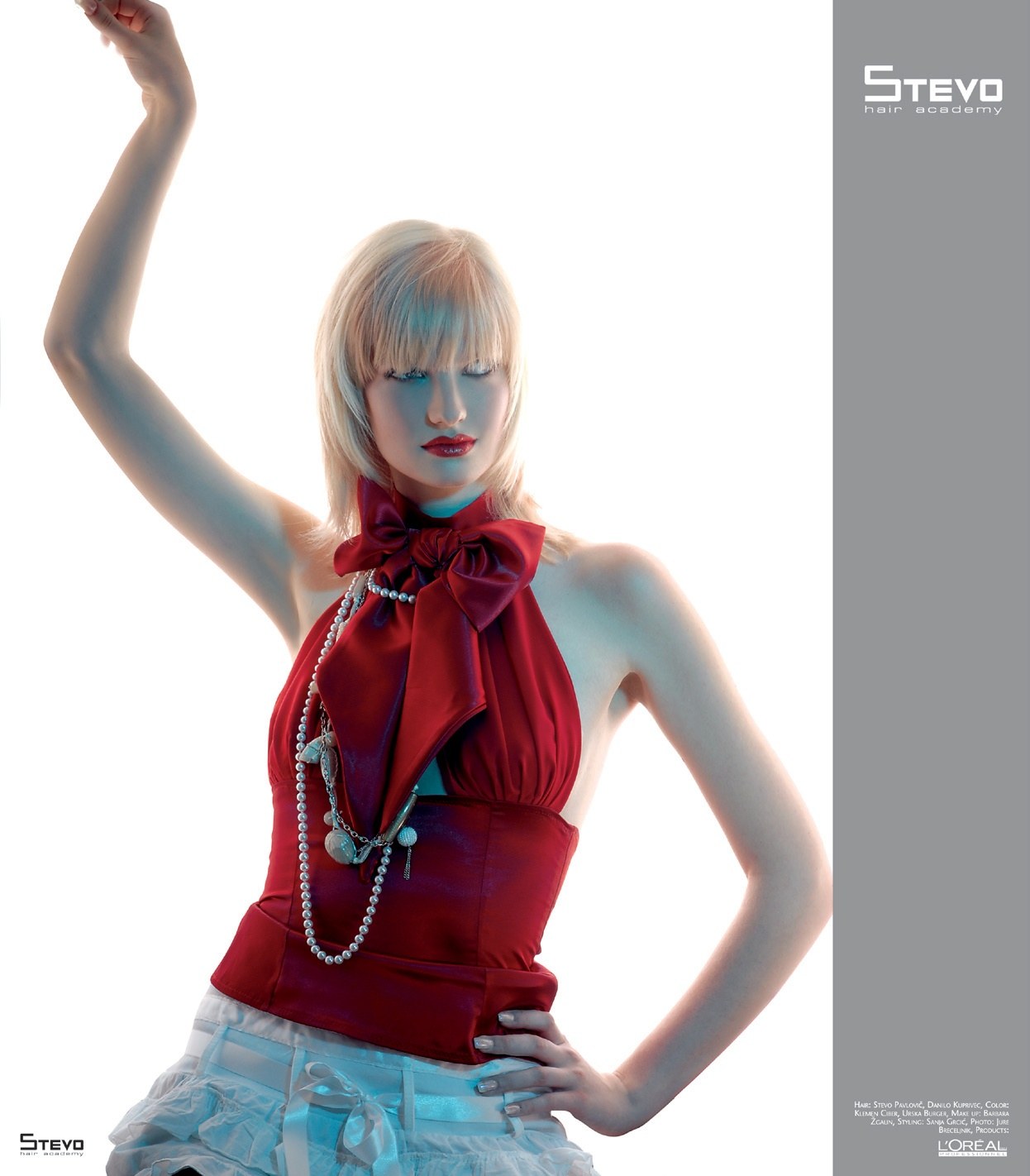 Long platinum cut with a soft fringe, red halter top – Chic It Collection, Stevo Hair Academy 2008
