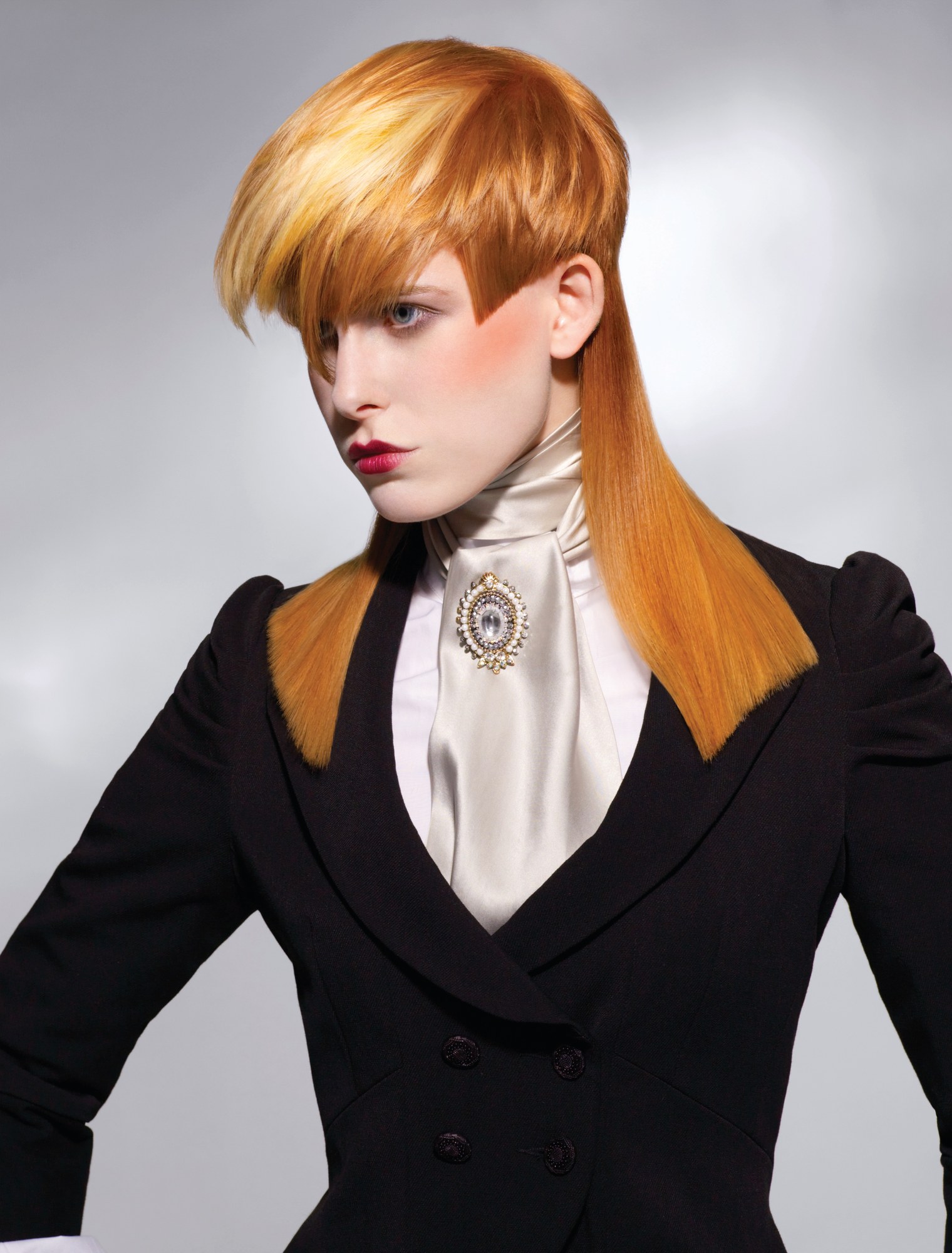 Golden cap shape with a sweeping fringe over long straight lengths – Gilded Youth Collection, Sassoon 2008