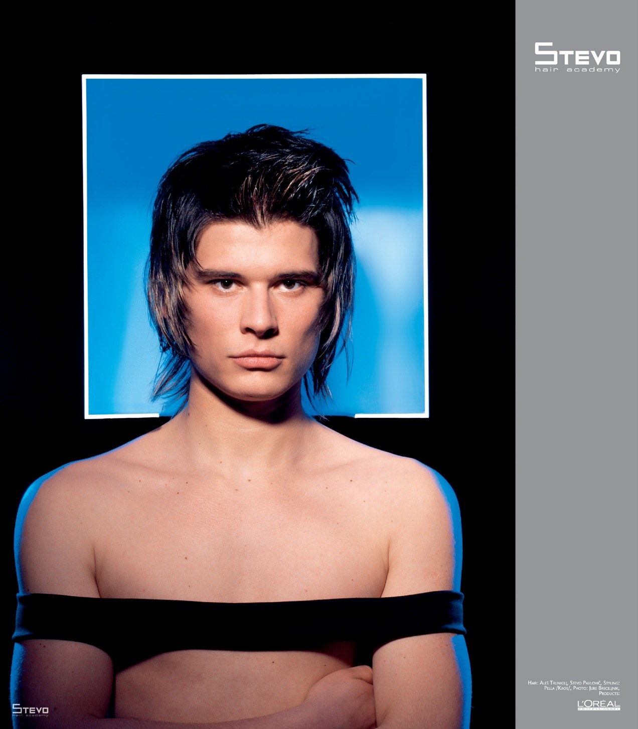 Men's shaggy layered cut at shoulder length, blue frame behind – HIM Collection, Stevo Hair Academy 2008