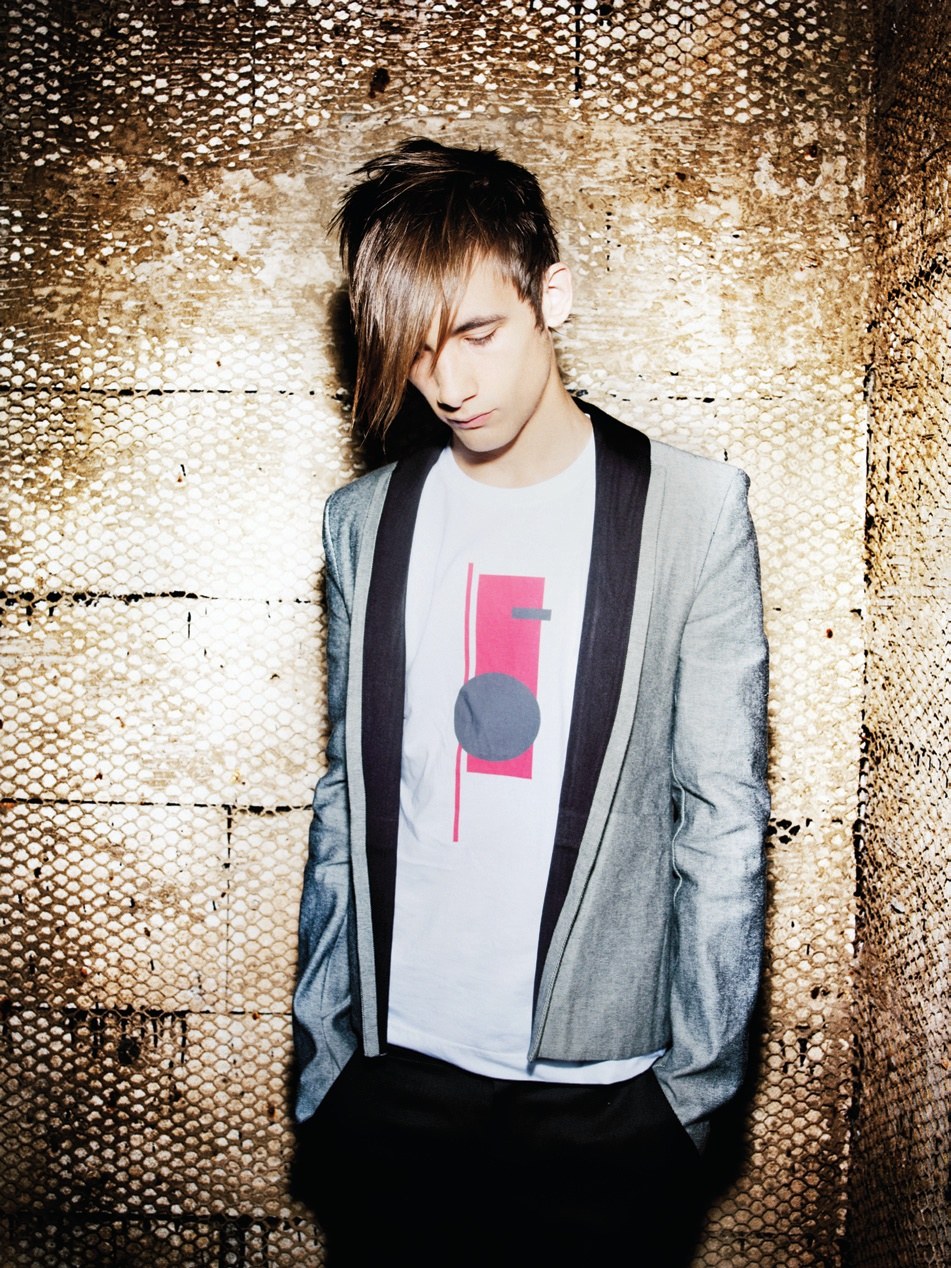 Men's long layered fringe falling over one eye, grey blazer – Instinctive Collection, TIGI International Creative Team 2008