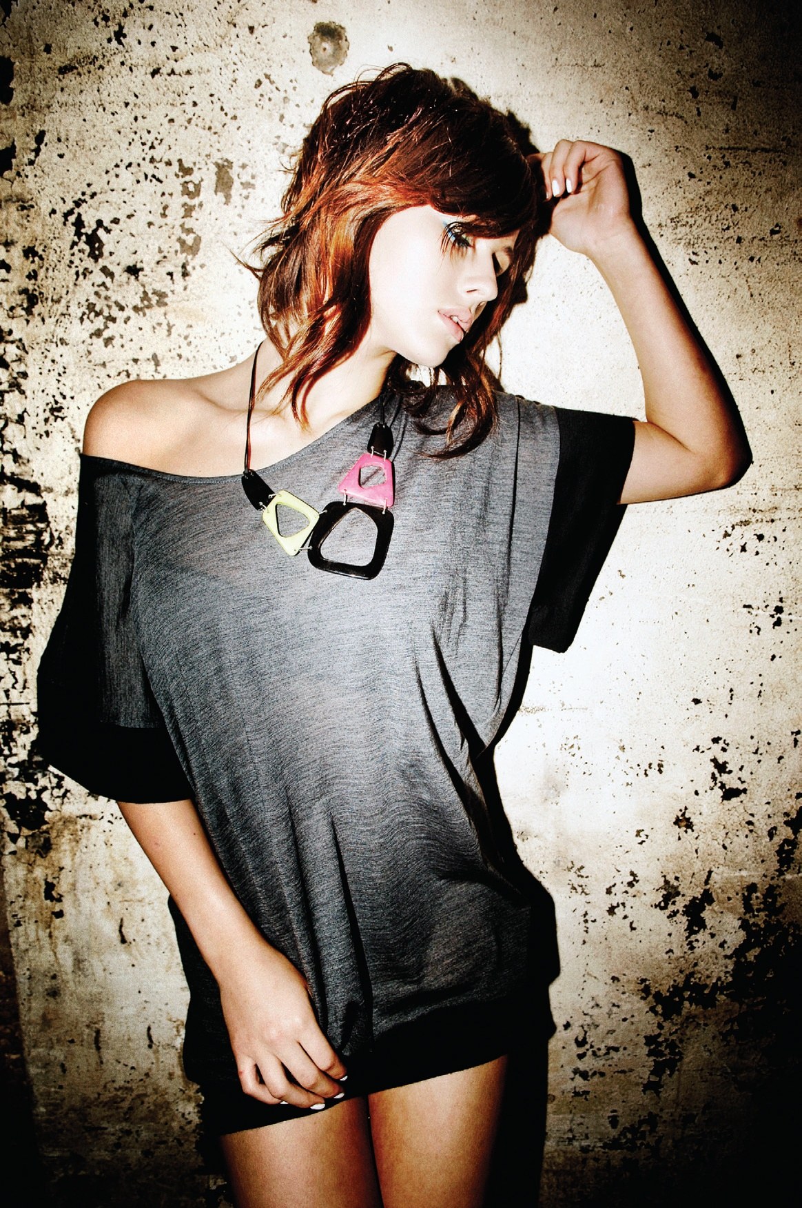 Tousled copper layers pushed back by hand, grey T-shirt – Instinctive Collection, TIGI International Creative Team 2008