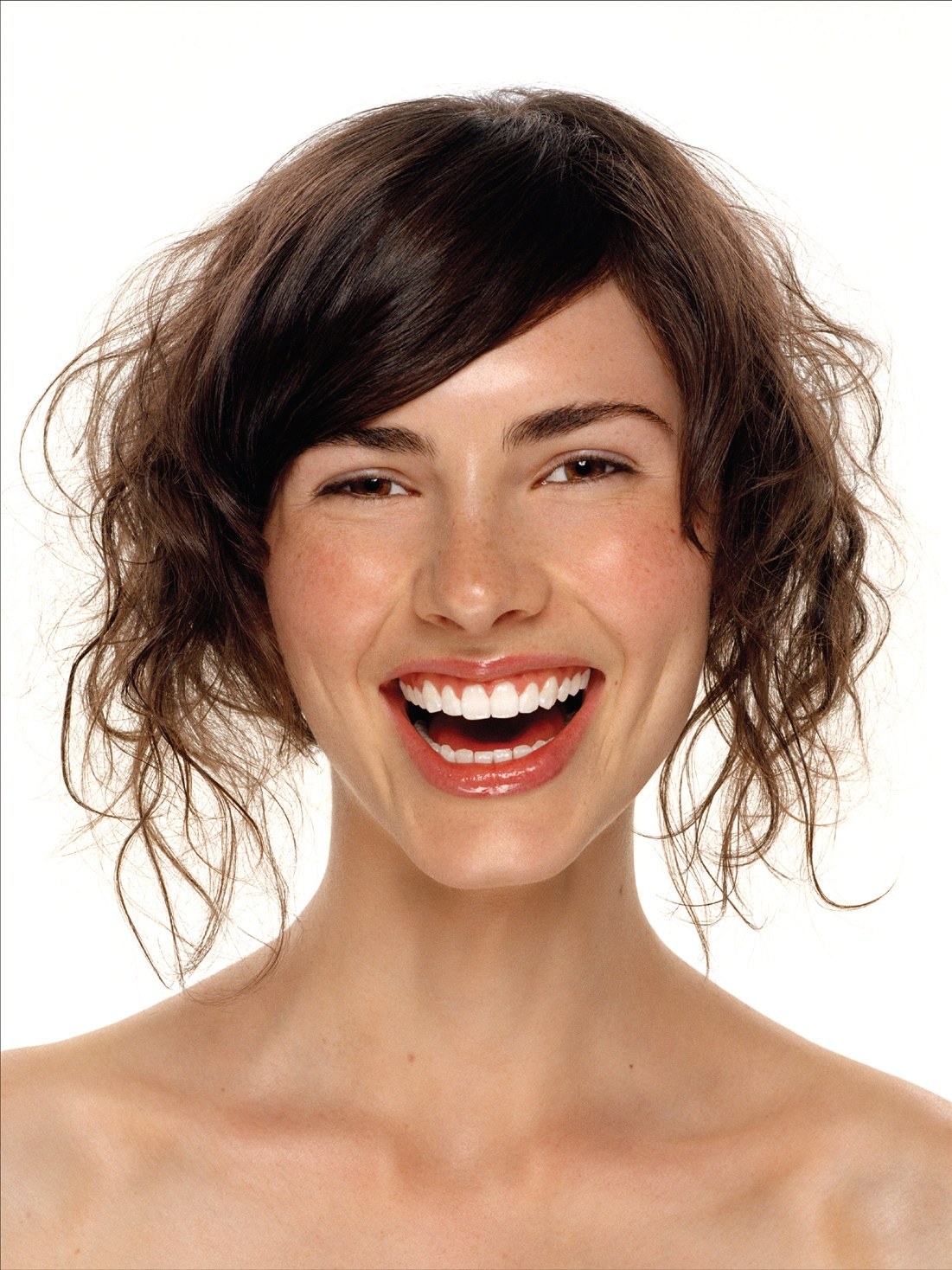 Tousled brunette waves with a side parting, smiling portrait – Toni & Guy Collections, Phil Smith 2008